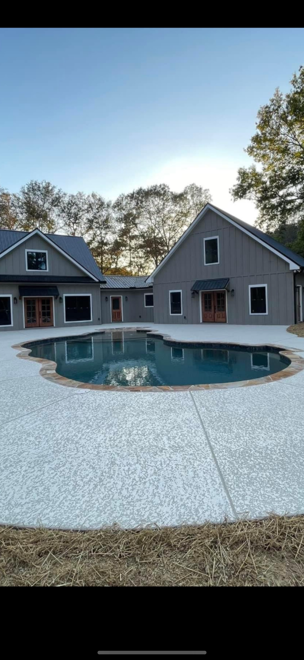 Freeform Pool with Farmhouse Backdrop